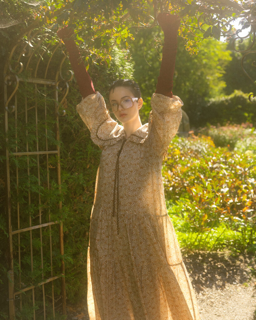 model Eva Lou of System Agency Montreal in a manicured garden, styled by Uyen Dao, hair and makeup by Gabbie Mcguire and photographed by Megane Brunette