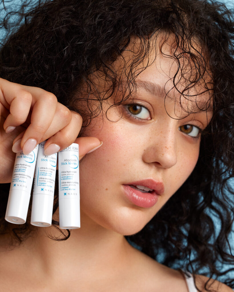 Image of a model showing Bioderma lip product