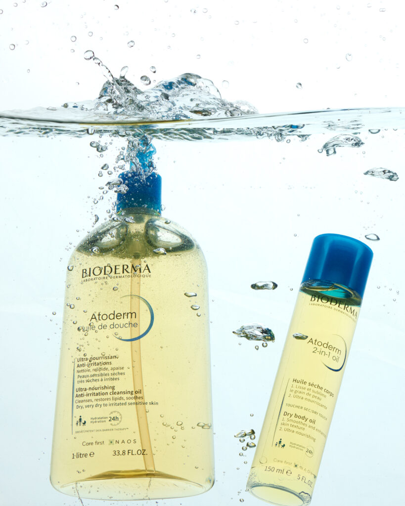 Bioderma shower oils splashing in water